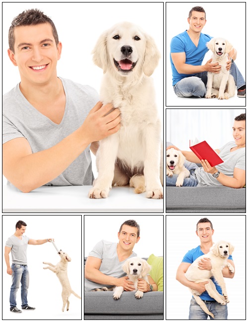 Smiling young man holding a dog - Stock Photo