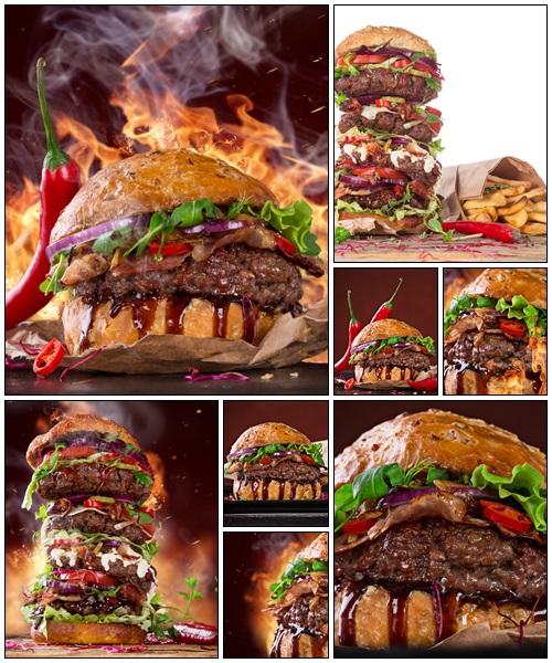 Delicious big hamburger on wood - Stock Photo